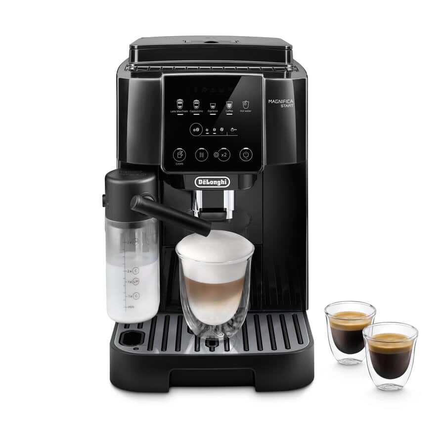 De'Longhi Magnifica Start ECAM22080B compact super-automatic espresso machine in black — 13-setting steel conical burr grinder, LatteCrema Hot automatic milk carafe, latte macchiato pouring into a tall glass alongside two clear espresso shots.