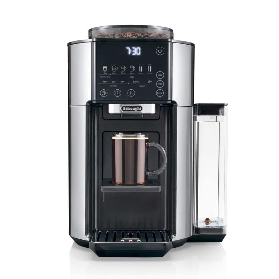 De'Longhi TrueBrew CAM51025MB automatic bean-to-cup drip coffee maker in stainless steel — top-loaded whole-bean hopper, six brew-size touch panel from 3 to 24 oz, drip spout brewing into a copper travel mug.