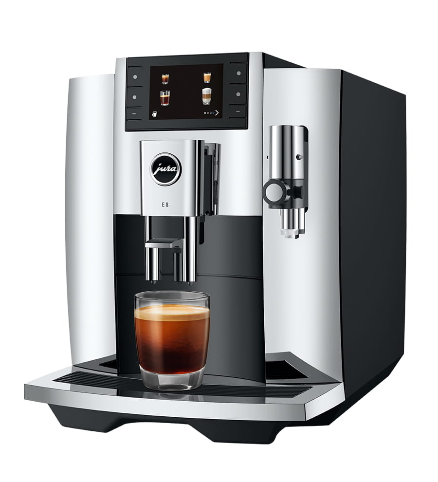 Jura E8 NAC 15646 fully automatic espresso machine in chrome — 3.5-inch color display showing drink specialties, AromaG3 ceramic burr grinder, black espresso pouring into a small clear glass.